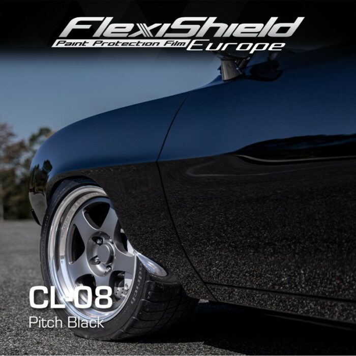 Un gros plan met en valeur une voiture brillante et de couleur sombre, mettant en valeur ses roues et sa carrosserie, rehaussées de FLEXISHIELD Cosmétique PPF pour une protection optimale. L'image affiche le texte : FLEXISHIELD Cosmétique PPF CL-08 Pitch Black dans les parties supérieure et inférieure. La scène se déroule à l'extérieur sur une surface pavée. - Tekalab